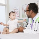 How to Become a Pediatrician? How Long Does it Take? 5 doctor and nurse examining baby in doctor s office 146263966 5956b0385f9b58843f1060cc
