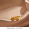 gold ring on silk background 260nw 1915877215