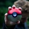 person holding pokemon ball toy